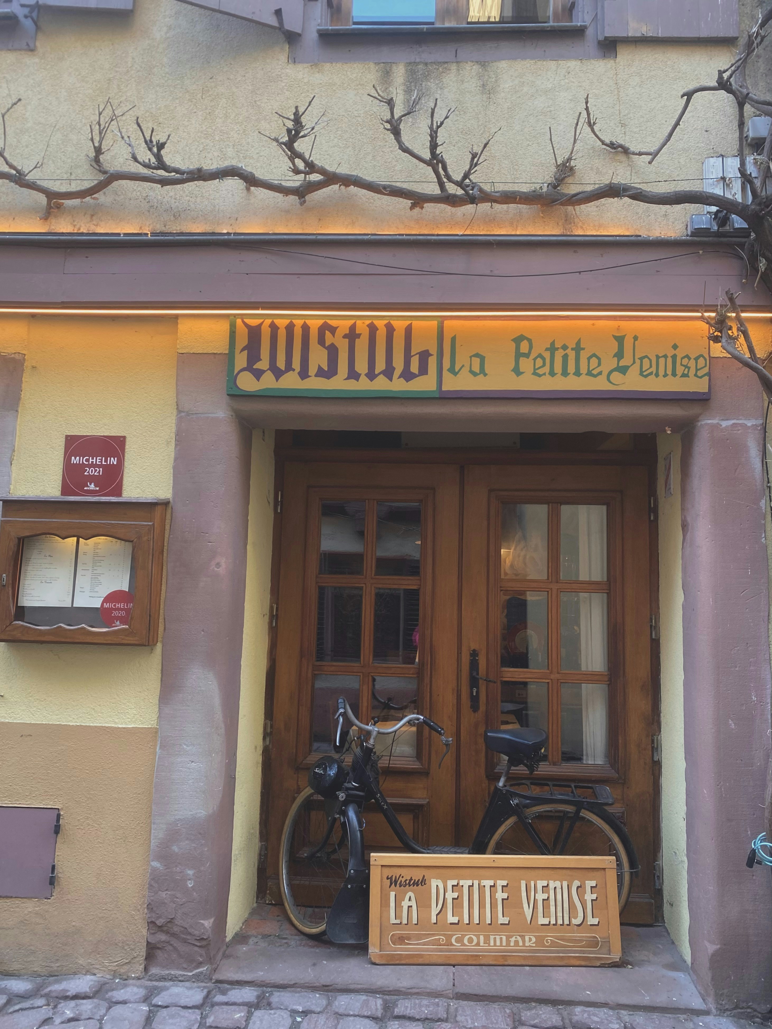 a bike is parked outside of a building